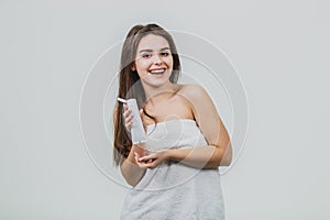 Hand Skin Care. Close Up Of Female Hands Applying Cream, Lotion. Beautiful Woman Hands With Red Manicure. Nails Applying