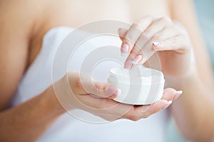 Hand Skin Care. Close Up Of Female Hands Holding Cream Tube, Beautiful Woman Hands With Natural Manicure Nails Applying