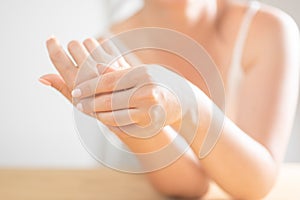 Hand Skin Care. Closeup Of Beautiful Female Hands With Natural Manicure Nails. Close Up Of Woman`s Hand Touching Her Soft Silky