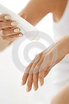 Hand Skin Care. Closeup Of Female Hands Holding Cream Tube