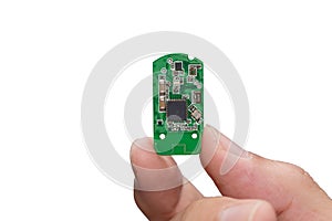 Hand with small electronic microchip microcontroller isolated