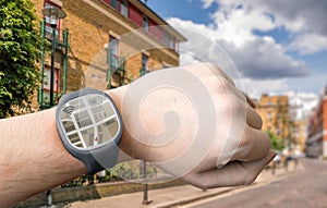 Hand with smart watch and GPS navigation system