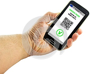 Hand with a smartphone with the digital green pass of the european union and the QR code