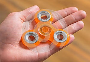 Hand with spinner toy