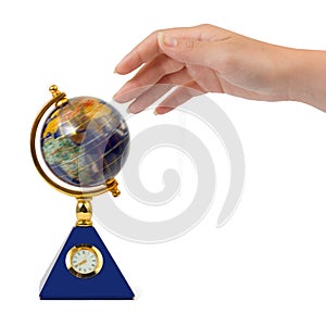 Hand and spinning globe