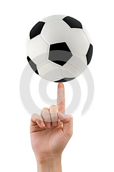 Hand and spinning soccer ball