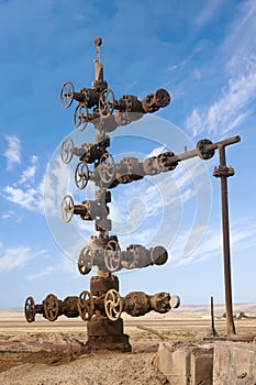 Hand spinning wheel on oil pipeline in Azerbaijan desert
