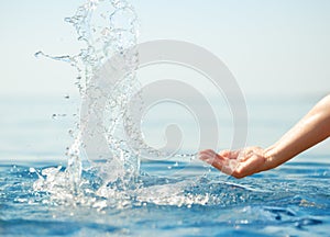 Hand splashing clean water