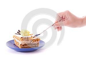 Hand with spoon snap off a peace of cake