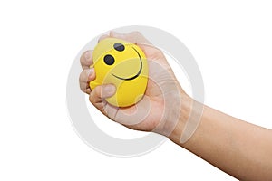 Hand squeeze yellow stress ball, isolated on white background, anger management, positive thinking concepts