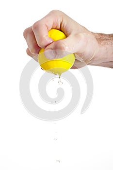 Hand squeezing lemon