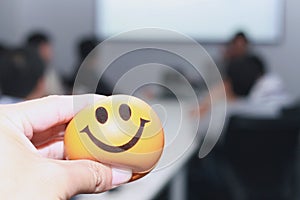 Hand squeezing the stress ball