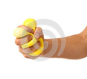 Hand squeezing stress ball on white background