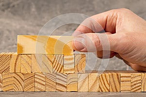 Hand stacking wooden blocks