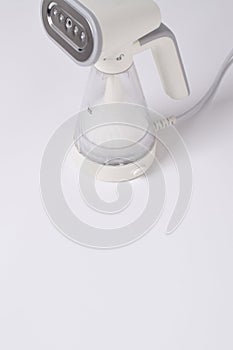 Hand steamer for clothes isolated on a white background