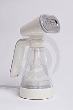 Hand steamer for clothes isolated on a white background