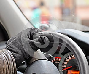 Hand on steering wheel closeup