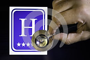 Hand with Stethoscope Hearing International Hotel Symbol