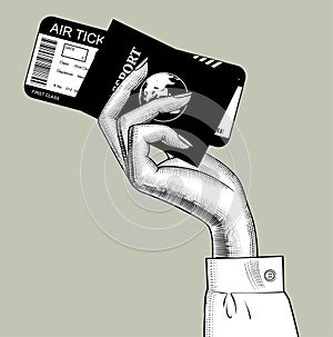 Hand of stewardess with passport and air ticket