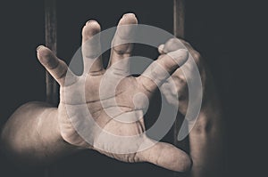 A hand sticking out of a detention attempt photo