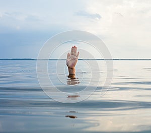 Hand sticking out of water