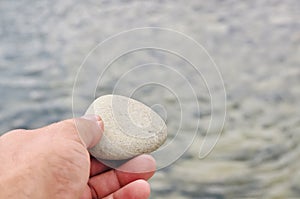 Hand with stone