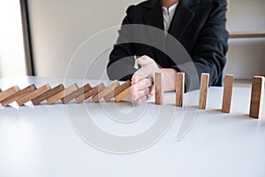 Hand stop blocks wood game, gambling placing wooden block. Concept Risk of management and strategy plan