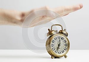 Hand stopping alarm on clock