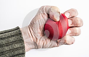 Hand of stressed man squeezing ball