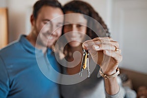 Hand, success or happy couple with house keys in real estate, property investment or buying apartment. New home blur