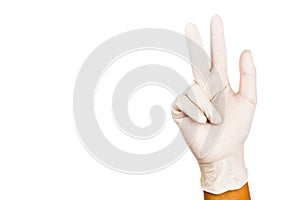 Hand in surgical latex glove gesture number Eight