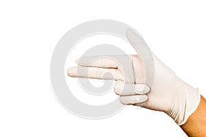 Hand in surgical latex glove gesture pointing and shooting