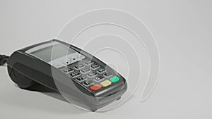 Hand swiping credit card on POS terminal