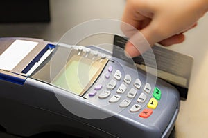 Hand Swiping Credit Card photo
