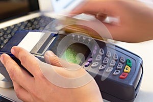 Hand Swiping Credit Card In Store