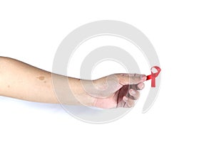 hand symbol with red ribbon signifying concern for people with HIV aids isolated on white background