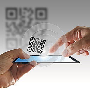 Hand and tablet computer scan Qr code