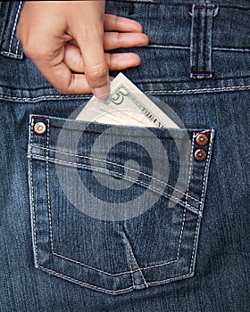 Hand taking money from pocket