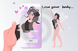 Hand taking photo of girl in bikini on smartphone camera social network love your body concept