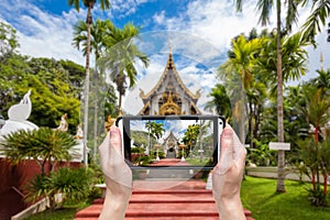 Hand taking photo at wat pha dara bhi rom Temple