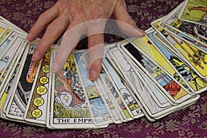 Hand on Tarot Cards