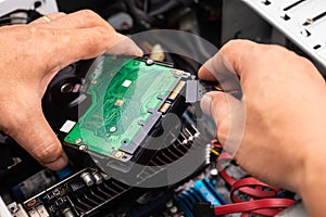 Hand of Technician Installing a Desktop Hard Drive ,check and re