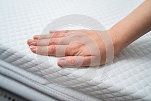 Hand Testing Mattress photo