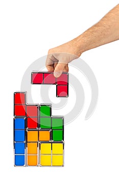 Hand with tetris toy blocks