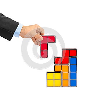 Hand with tetris toy blocks