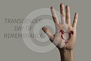 Hand and text transgender day of remembrance