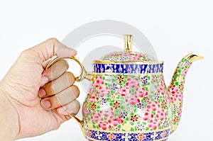 Hand and thai tea jar