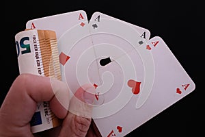 Hand with three aces and one money bet