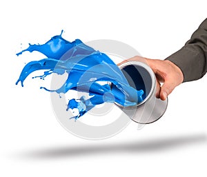 Hand throwing blue paint from can