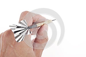 Hand throwing dart to target
